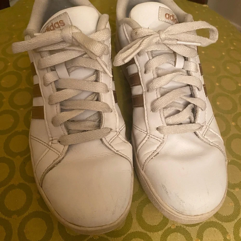 Adidas White and gold sneakers.